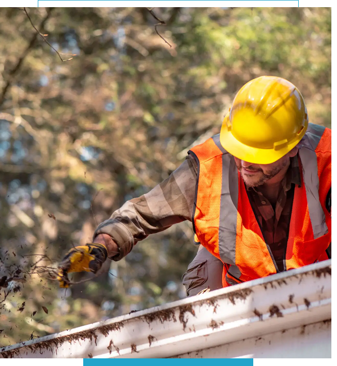 Construction worker in safety gear working outdoors.