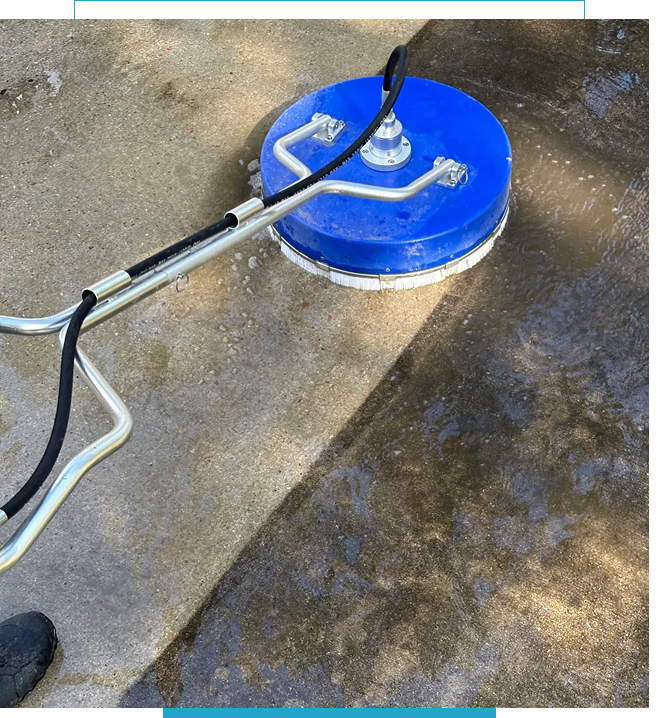 A surface cleaner pressure washer cleaning a concrete floor.